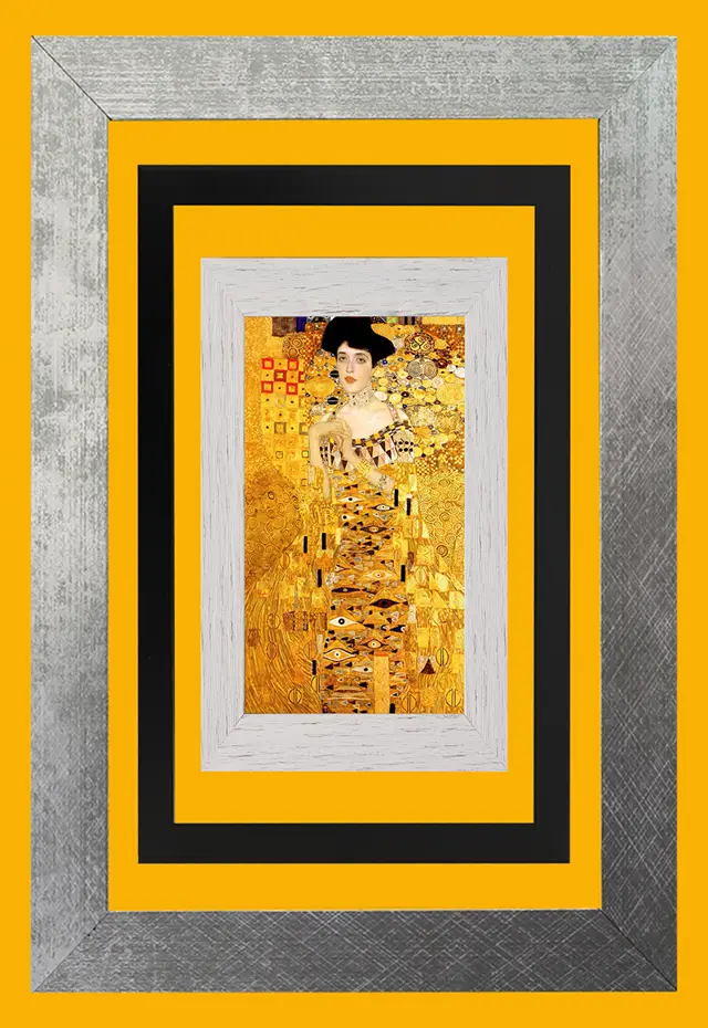 Framed wall art: a Klimt portrait in silver, black and white frames